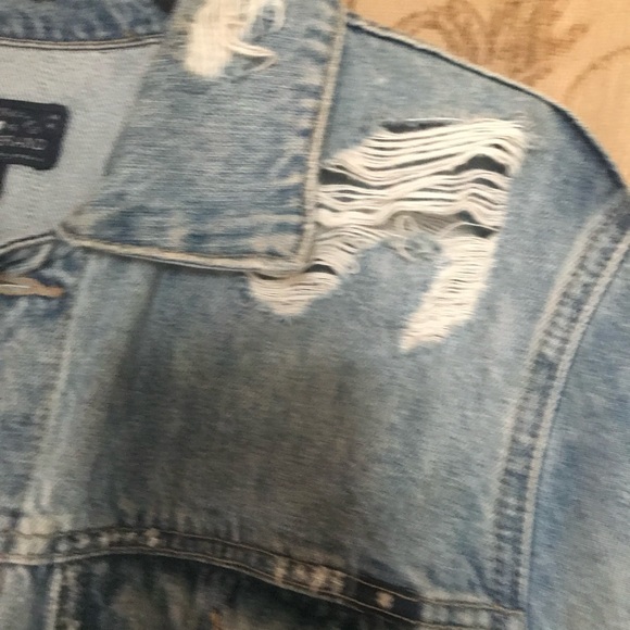 Distressed jean jacket, lots of rips and vintage looking. Comfy too - Picture 6 of 7